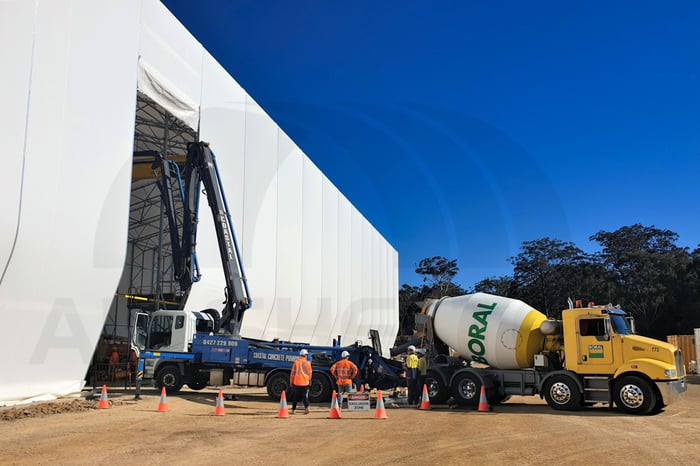 image of first pour and the fabric building pre-cast facility